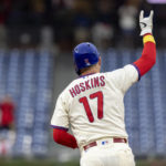 
              Philadelphia Phillies' Rhys Hoskins gestures after hitting a three-run home run during the fifth inning of a baseball game against the Washington Nationals, Sunday, Sept. 11, 2022, in Philadelphia. (AP Photo/Laurence Kesterson)
            