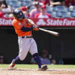 
              Houston Astros' Jose Altuve hits a two-run home run during the seventh inning of a baseball game against the Los Angeles Angels, Sunday, Sept. 4, 2022, in Anaheim, Calif. (AP Photo/Jae C. Hong)
            