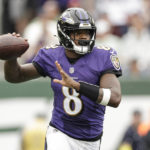 
              Baltimore Ravens quarterback Lamar Jackson (8) looks to throw a pass during the first half of an NFL football game against the New York Jets, Sunday, Sept. 11, 2022, in East Rutherford, N.J. (AP Photo/Adam Hunger)
            