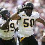 
              Appalachian State defensive lineman DeAndre Dingle-Prince (50) and teammate Jordon Earle (99) react after recovering a fumble by Texas A&M quarterback Haynes King during the first quarter of an NCAA college football game Saturday, Sept. 10, 2022, in College Station, Texas. (AP Photo/Sam Craft)
            