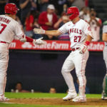 
              Los Angeles Angels' Shohei Ohtani, left, celebrates with Mike Trout, center, after Trout's solo home run with Oakland Athletics catcher Sean Murphy looking away during the fourth inning of a baseball game in Anaheim, Calif., Wednesday, Sept. 28, 2022. (AP Photo/Alex Gallardo)
            