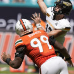 
              Miami defensive lineman Elijah Roberts (99) rushes Southern Miss quarterback Zach Wilcke during the second half of an NCAA college football game, Saturday, Sept. 10, 2022, in Miami Gardens, Fla. (AP Photo/Wilfredo Lee)
            