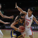 
              Bosnia and Herzegovina's Dragana Domuzin collides with China's Dilana Dilixiati, right, during their game at the women's Basketball World Cup in Sydney, Australia, Friday, Sept. 23, 2022. (AP Photo/Mark Baker)
            