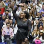 
              Serena Williams, of the United States, spins as she waves to fans after losing to Ajla Tomljanovic, of Austrailia, in the third round of the U.S. Open tennis championships, Friday, Sept. 2, 2022, in New York. (AP Photo/John Minchillo)
            