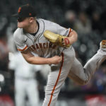 
              San Francisco Giants starting pitcher Logan Webb works against the Colorado Rockies during the sixth inning of a baseball game Wednesday, Sept. 21, 2022, in Denver. (AP Photo/David Zalubowski)
            