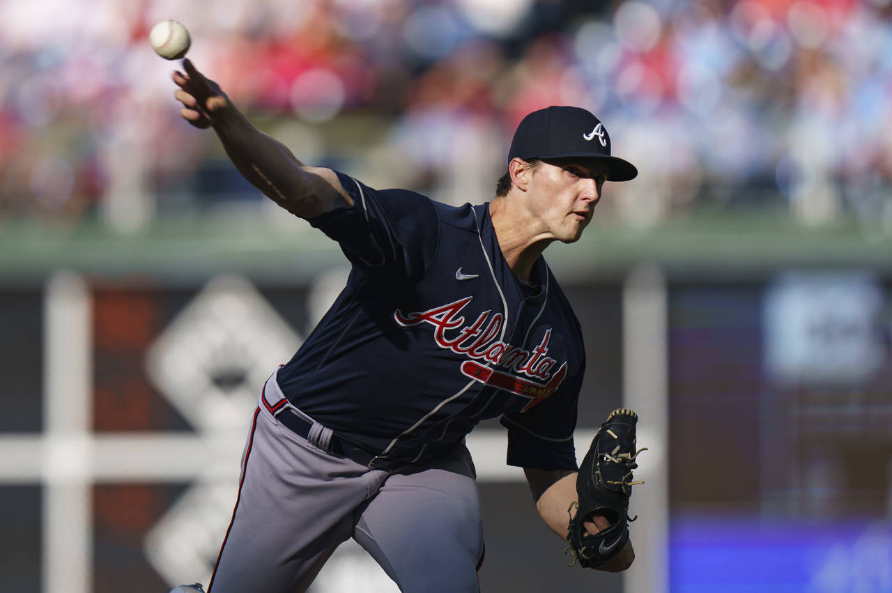 Atlanta Braves starting pitcher Kyle Wright throws during the first inning of a baseball game again...
