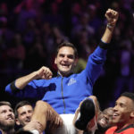 
              Team Europe's Roger Federer is lifted by fellow players after playing with Rafael Nadal in a Laver Cup doubles match against Team World's Jack Sock and Frances Tiafoe at the O2 arena in London, Friday, Sept. 23, 2022. Federer's losing doubles match with Nadal marked the end of an illustrious career that included 20 Grand Slam titles and a role as a statesman for tennis. (AP Photo/Kin Cheung)
            