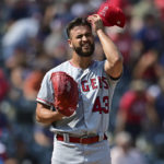 
              Los Angeles Angels starting pitcher Patrick Sandoval reacts after a solo home run by Cleveland Guardians' Oscar Gonzalez during the second inning of a baseball game, Wednesday, Sept. 14, 2022, in Cleveland. (AP Photo/David Dermer)
            