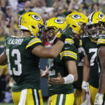 
              Green Bay Packers wide receiver Allen Lazard (13) celebrates with teammate quarterback Aaron Rodgers (12) after catching a 5-yard touchdown pass during the first half of an NFL football game against the Chicago Bears Sunday, Sept. 18, 2022, in Green Bay, Wis. (AP Photo/Mike Roemer)
            