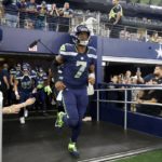 
              Seattle Seahawks quarterback Geno Smith leads the team onto the field or the first half of a preseason NFL football game against the Dallas Cowboys in Arlington, Texas, Friday, Aug. 26, 2022. (AP Photo/Michael Ainsworth)
            