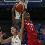 
              United States' Jewell Loyd keeps the ball from Puerto Rico's Pamela Rosado at the women's Basketball World Cup in Sydney, Australia, Friday, Sept. 23, 2022. (AP Photo/Mark Baker)
            