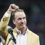
              FILE - Former Indianapolis Colts player Peyton Manning holds up his Pro Football Hall of Fame commemorative ring during an NFL football game, Sunday, Sept. 19, 2021, in Indianapolis. The NFL is replacing the Pro Bowl with weeklong skills competitions and a flag football game. The new event will be renamed “The Pro Bowl Games” and will feature AFC and NFC players showcasing their football and non-football skills in challenges over several days.  Manning and his Omaha Productions company will help shape programming and promote the event’s content throughout the week.   (AP Photo/Michael Conroy, File)
            