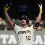 
              Milwaukee Brewers' Hunter Renfroe reacts after hitting an RBI double during the fourth inning of game 1 of a doubleheader baseball game against the San Francisco Giants Thursday, Sept. 8, 2022, in Milwaukee. (AP Photo/Morry Gash)
            