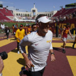 
              Southern California head coach Lincoln Riley runs off the field after his team warmed up before an NCAA college football game against Rice in Los Angeles, Saturday, Sept. 3, 2022. (AP Photo/Ashley Landis)
            