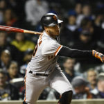 
              San Francisco Giants' Thairo Estrada watches his RBI single during the fourth inning of a baseball game against the Chicago Cubs, Sunday, Sept. 11, 2022, in Chicago. (AP Photo/Paul Beaty)
            