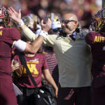 
              Minnesota head coach P.J. Fleck celebrates with quarterback Tanner Morgan and wide receiver Chris Autman-Bell (7) after Autman-Bell caught a touchdown pass against Colorado during the first half of an NCAA college football game, Saturday, Sept. 17, 2022, in Minneapolis. (AP Photo/Stacy Bengs)
            
