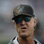 
              FILE - Miami Marlins manager Don Mattingly looks on before a baseball game against the Washington Nationals, Sept. 17, 2022, in Washington. Mattingly will not be back as manager of the Marlins next season, a person with knowledge of the matter said. Mattingly’s contract expires when the season ends and he and the team have agreed that a mutual parting is best for both sides, according to the person, who spoke Sunday, Sept. 25, 2022 to The Associated Press on condition of anonymity because there had been no public announcement. (AP Photo/Nick Wass)
            