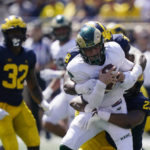 
              Colorado State quarterback Clay Millen is sacked by Michigan linebacker Michael Barrett (23) during the first half of an NCAA college football game, Saturday, Sept. 3, 2022, in Ann Arbor, Mich. (AP Photo/Carlos Osorio)
            