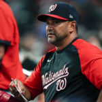 
              Washington Nationals manager David Martinez watches from the dugout as his team plays against the Atlanta Braves in a baseball game Monday, Sept. 19, 2022, in Atlanta. (AP Photo/John Bazemore)
            