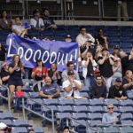 
              Fans cheer for Minnesota Twins starting pitcher Louie Varland during the second inning of the first baseball game of a doubleheader against the New York Yankees on Wednesday, Sept. 7, 2022, in New York. (AP Photo/Adam Hunger)
            