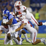 
              Kentucky running back JuTahn McClain, front left, is tackled by Miami (Ohio) linebacker Ryan McWood (35), defensive lineman Brian Ugwu (8), defensive lineman Austin Ertl, bottom left, and defensive back Eli Blakey, center, during the second half of an NCAA college football game in Lexington, Ky., Saturday, Sept. 3, 2022. (AP Photo/Michael Clubb)
            