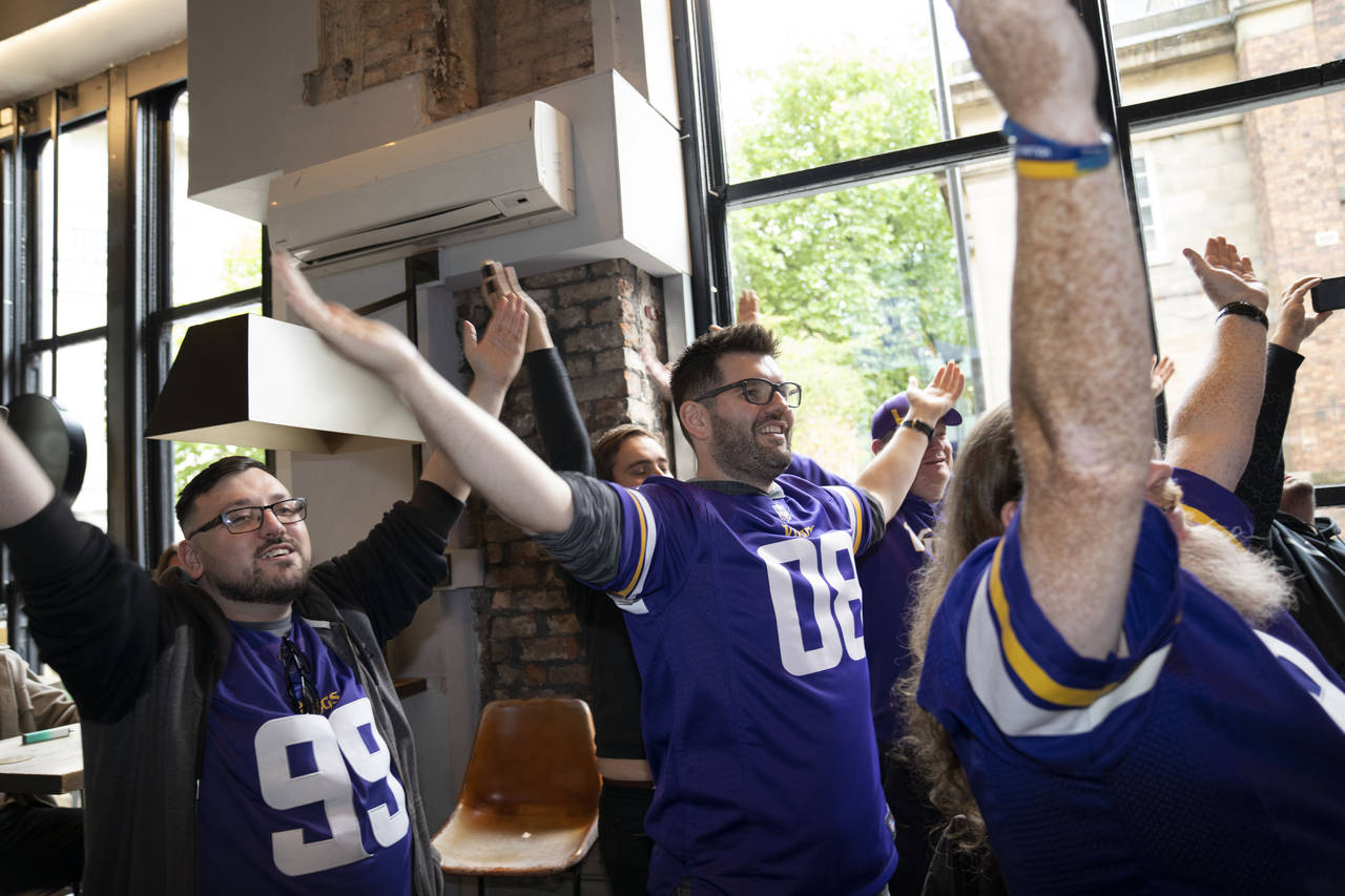 Supporters of the the The Minnesota Vikings team cheer at a fan interaction event at The Brotherhoo...