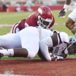 
              CORRECTS TO MISSOURI STATE DEFENDER IKENNA AHUMIBE NOT VON YOUNG - Missouri State defender Ikenna Ahumibe bottom, recovers an Arkansas fumble in the end zone during the first half of an NCAA college football game Saturday, Sept. 17, 2022, in Fayetteville, Ark. (AP Photo/Michael Woods)
            