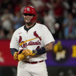 
              St. Louis Cardinals' Yadier Molina smiles after hitting a double during the fifth inning of a baseball game against the Washington Nationals Wednesday, Sept. 7, 2022, in St. Louis. (AP Photo/Jeff Roberson)
            