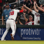 
              Atlanta Braves first baseman Matt Olson (28) can't catch a foul by hit by Washington Nationals' Luke Voit during the fourth inning of a baseball game Tuesday, Sept. 20, 2022, in Atlanta. (AP Photo/John Bazemore)
            