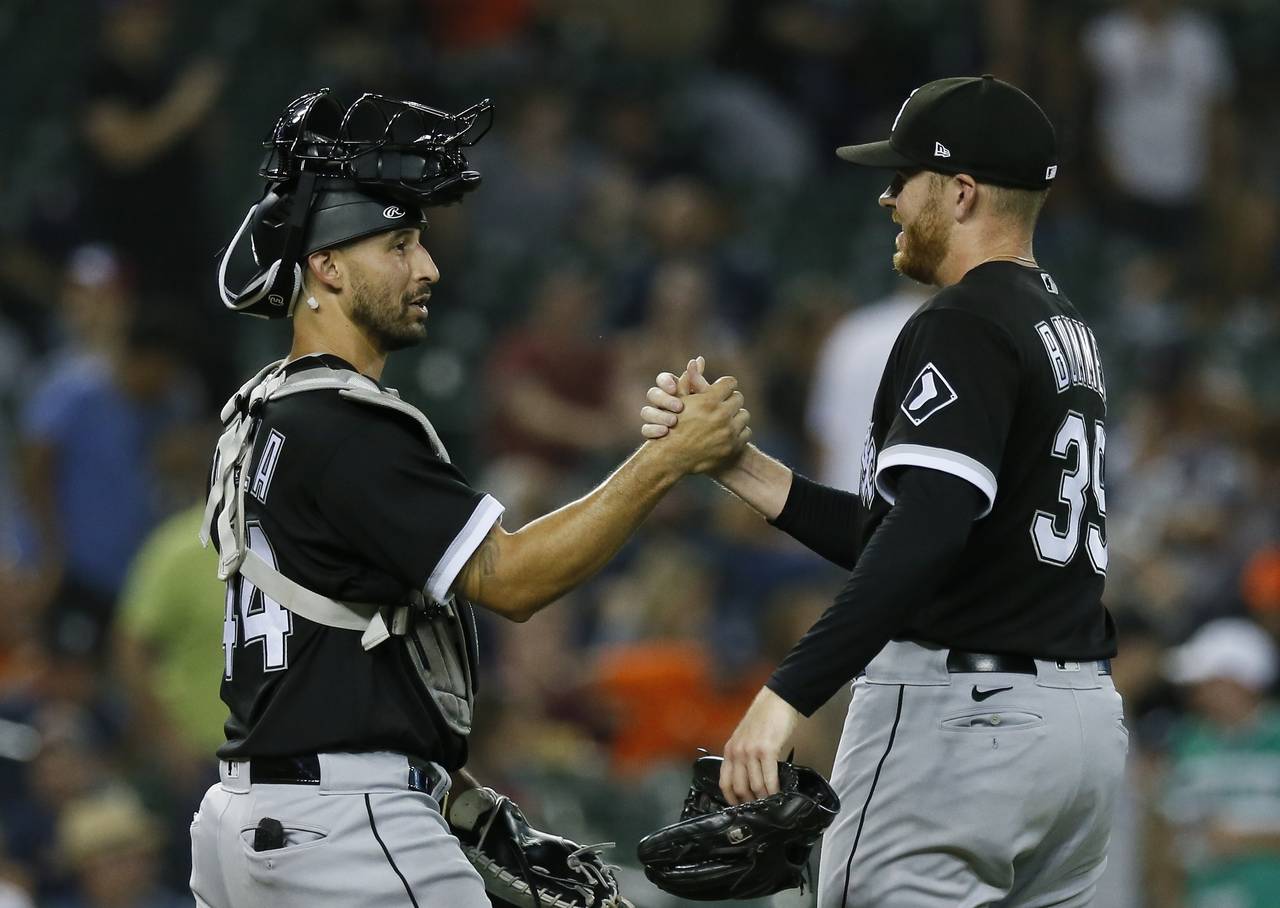 Chicago White Sox catcher Seby Zavala, left, celebrates with pitcher Aaron Bummer after a win over ...