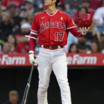 
              Los Angeles Angels designated hitter Shohei Ohtani (17) holds his helmet during the first inning of a baseball game against the Houston Astros in Anaheim, Calif., Friday, Sept. 2, 2022. (AP Photo/Ashley Landis)
            