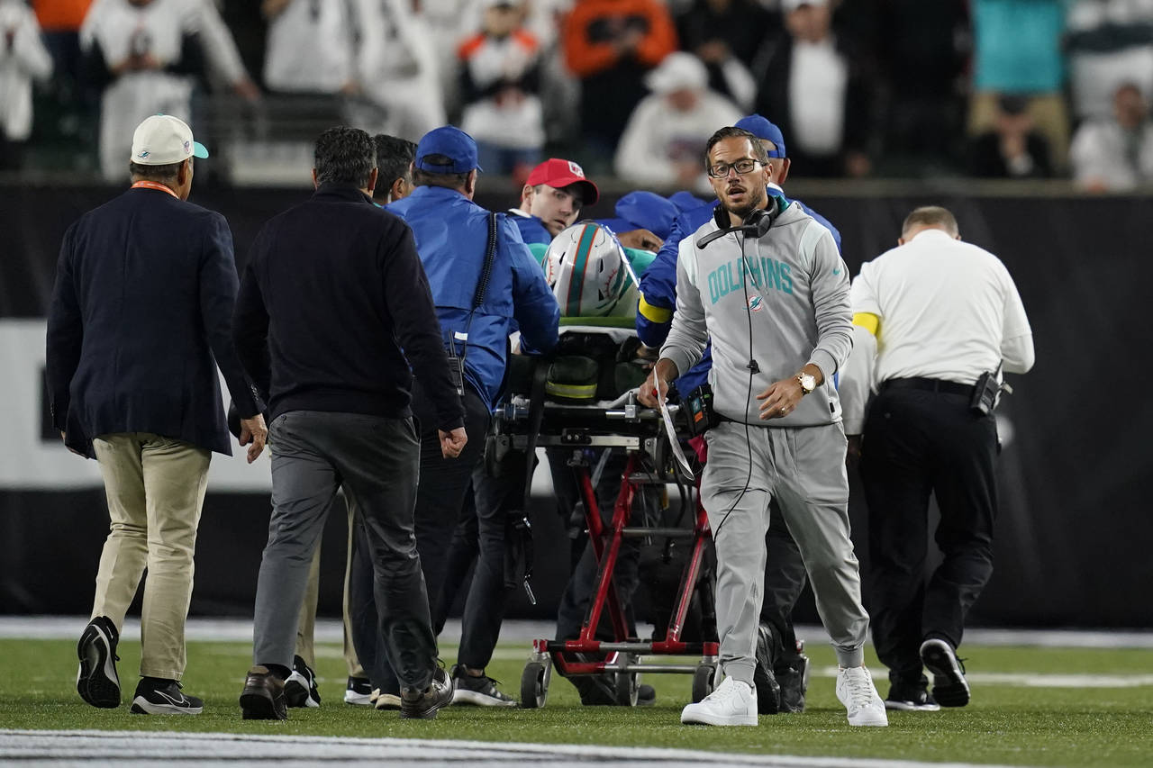 Miami Dolphins head coach Mike McDaniel walks away as quarterback Tua Tagovailoa is taken off the f...