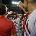 
              St. Louis Cardinals designated hitter Albert Pujols, center,celebrates with teammates after hitting a home run during the fourth inning of a baseball game against the Los Angeles Dodgers in Los Angeles, Friday, Sept. 23, 2022. Brendan Donovan and Tommy Edman also scored. It was Pujols' 700th career home run. (AP Photo/Ashley Landis)
            