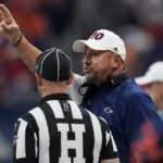 
              UTSA head coach Jeff Traylor, right, argues a call during the first half of an NCAA college football game against Houston, Saturday, Sept. 3, 2022, in San Antonio. (AP Photo/Eric Gay)
            