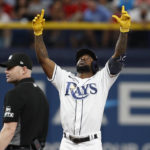 
              Tampa Bay Rays' Randy Arozarena, right, reacts after hitting an RBI-double against the Boston Red Sox during the fifth inning of a baseball game Monday, Sept. 5, 2022, in St. Petersburg, Fla. (AP Photo/Scott Audette)
            
