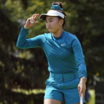 
              Lucy Li acknowledges the gallery after making a birdie putt on the sixth hole during the second round of the Dana Classic LPGA golf tournament Friday, Sept. 2, 2022, at the Highland Meadows Golf Club in Sylvania, Ohio. (AP Photo/Gene J. Puskar)
            