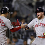 
              Boston Red Sox's Alex Verdugo celebrates his three-run home run with Enrique Hernandez (5) during the sixth inning of the team's baseball game against the New York Yankees on Friday, Sept. 23, 2022, in New York. (AP Photo/Adam Hunger)
            