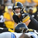 
              Pittsburgh Steelers quarterback Kenny Pickett (8) call signals at the line of scrimmage as he plays against the Detroit Lions during the second half of an NFL preseason football game, Sunday, Aug. 28, 2022, in Pittsburgh. (AP Photo/Don Wright)
            