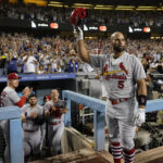 
              St. Louis Cardinals designated hitter Albert Pujols (5) celebrates after hitting a home run during the fourth inning of a baseball game against the Los Angeles Dodgers in Los Angeles, Friday, Sept. 23, 2022. Brendan Donovan and Tommy Edman also scored. It was Pujols' 700th career home run. (AP Photo/Ashley Landis)
            