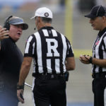 
              UCLA head coach Chip Kelly, left, talks with officials during the first half of an NCAA college football game against South Alabama in Pasadena, Calif., Saturday, Sept. 17, 2022. (AP Photo/Ashley Landis)
            