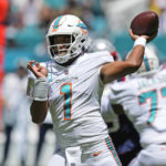 
              Miami Dolphins quarterback Tua Tagovailoa (1) aims a pass during the first half of an NFL football game against the New England Patriots, Sunday, Sept. 11, 2022, in Miami Gardens, Fla. (AP Photo/Rebecca Blackwell)
            