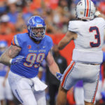 
              Boise State defensive tackle Scott Matlock (99) pressures Tennessee-Martin quarterback Dresser Winn (3) as Winn throws the ball in the second half of an NCAA college football game, Saturday, Sept. 17, 2022, in Boise, Idaho. (AP Photo/Steve Conner)
            