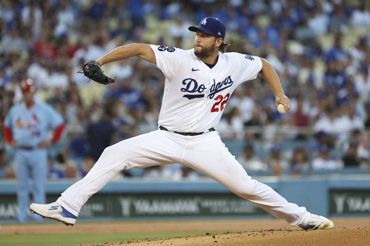 Los Angeles Dodgers starting pitcher Clayton Kershaw throws to the plate during the second inning o...
