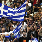 
              Greece's fans celebrate at the end of the Eurobasket group C basketball match between Croatia and Greece at the Assago Forum, near Milan, Italy, Friday Sept. 2, 2022. Greece beat Croatia 89-85. (AP Photo/Luca Bruno)
            