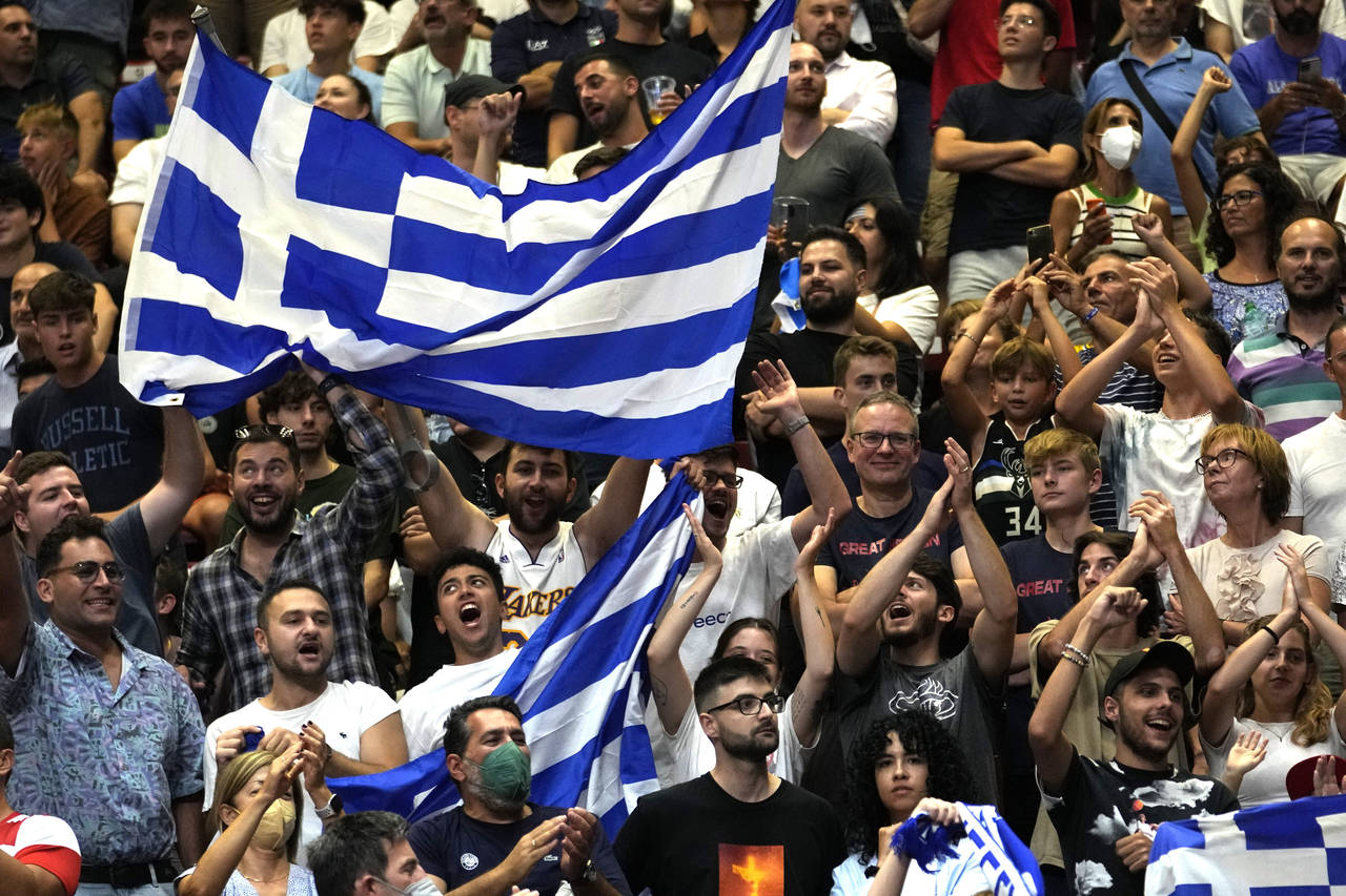 Greece's fans celebrate at the end of the Eurobasket group C basketball match between Croatia and G...