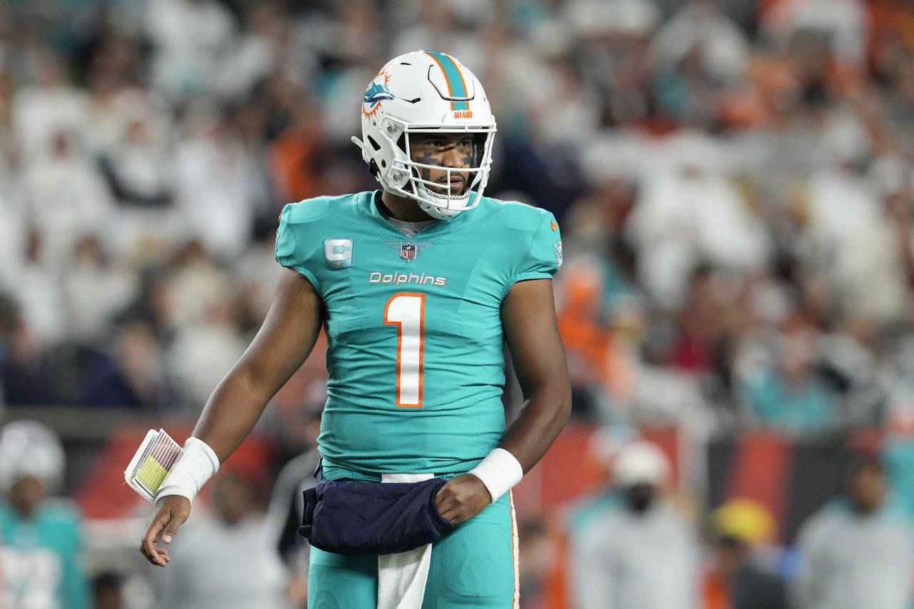 Miami Dolphins quarterback Tua Tagovailoa looks to the sidelines during the first half of an NFL fo...