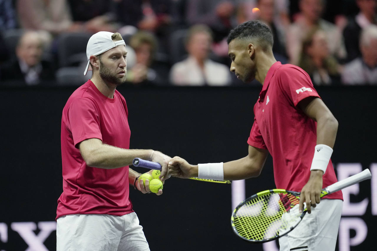 Team World's Jack Sock, left, and Felix Auger-Aliassime react during a match against Team Europe's ...