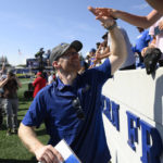 
              Delaware head coach Ryan Carty high fives fans after an NCAA college football game against Navy, Saturday, Sept. 3, 2022, in Annapolis, Md. Delaware won 14-7. (AP Photo/Nick Wass)
            