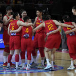 
              China's players celebrate their win over Australia in their semifinal game at the women's Basketball World Cup in Sydney, Australia, Friday, Sept. 30, 2022. (AP Photo/Rick Rycroft)
            