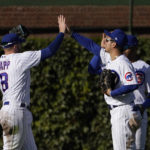 
              Chicago Cubs players, from left, Ian Happ, Seiya Suzuki and Nelson Velazquez celebrate the team's 2-0 win over the Philadelphia Phillies after a baseball game Thursday, Sept. 29, 2022, in Chicago. (AP Photo/Charles Rex Arbogast)
            